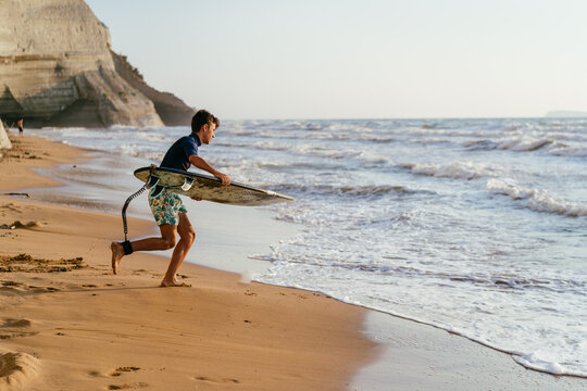 Boy surfing on the ocean