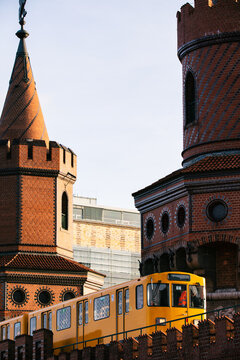 Yellow Berlin Subway Train Crossing Oberbaum Bridge