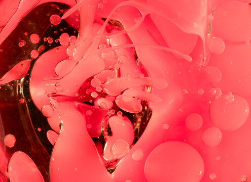 Swirling light red neon colors, looking like grapefruit juice