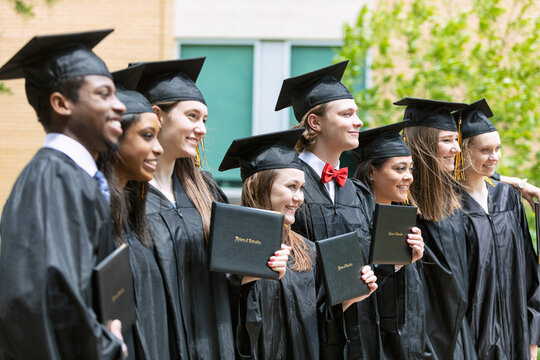 Grad: Group Of Graduate Friends Pose With Diplomas