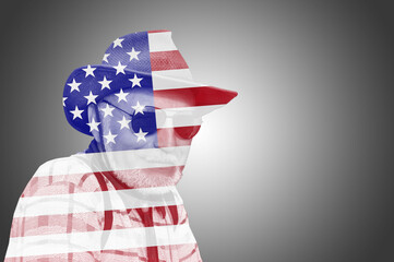 Silhouette of a man in a hat, with with the USA flag. American hero concept. Philosophy concept