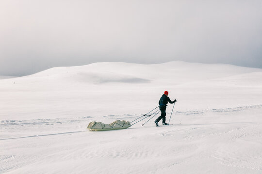 Solo Ski Adventurer Pulling Army Cargo Sled