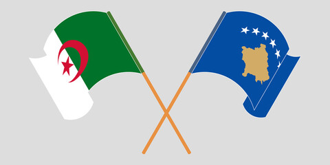 Crossed and waving flags of Kosovo and Algeria