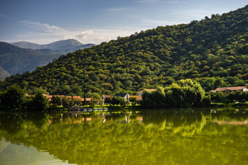 Fototapeta na wymiar Lopota lake with reflection of mountains