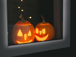 Halloween pumpkins at windows with bokeh. Happy  Halloween day.