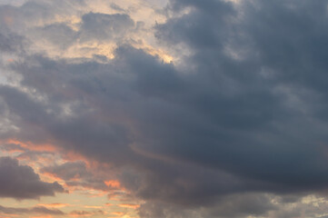 Naklejka na ściany i meble Abstract background of cloudy sunset sky golden hour.