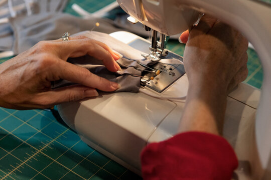 Woman Sewing Homemade Medical Masks During Virus Shortage