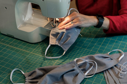 Woman Sewing Homemade Medical Masks During Virus Shortage