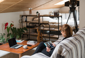 Woman having a video call with distant family using a digital tablet