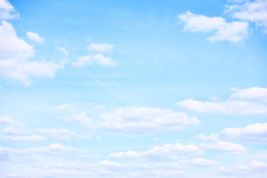 Light pastel blue sky with clouds