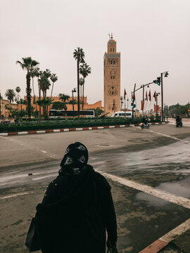 Muslim Woman Crossing Street Near Mosque