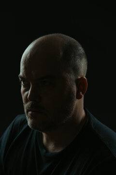 Intense dark portrait of a caucasian man