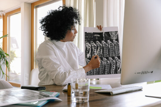 Telemedicine - Doctor Explaining MRI