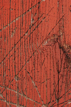 Red wood background texture with gouges
