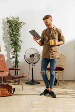Man Reading News at Home