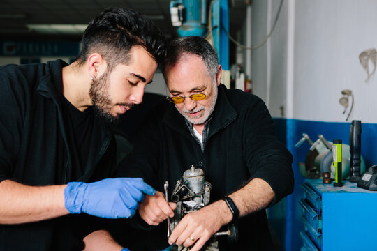 Two mechanics working