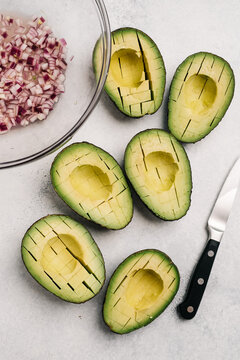 Sliced and halved avocados for guacamole