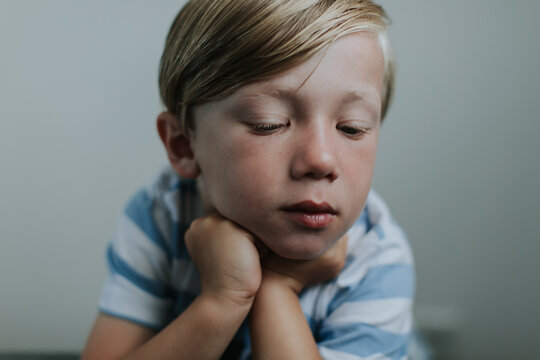 Portrait of a thoughtful young blond boy