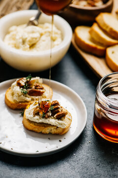 Crostini with honey whipped goat cheese and pecans
