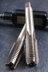 Naklejka premium Metal thread cutting tools. Tool steel accessories for locksmiths.
