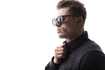 Portrait of beautyful guy on white background. High fashion model posing in studio. Attractive man in classic suit and sunglasses.