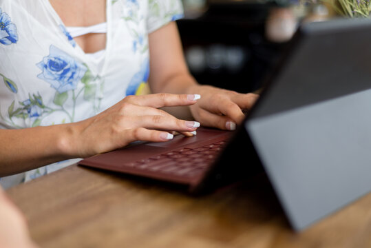 woman's hands on keyboard