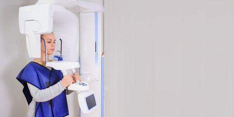 woman patient doing panoramic teeth x-ray