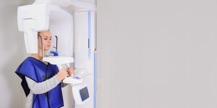 woman patient doing panoramic teeth x-ray