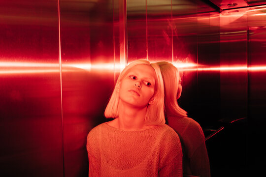 Young blond woman in the elevator