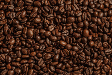 Roasted coffee beans brown and black background texture