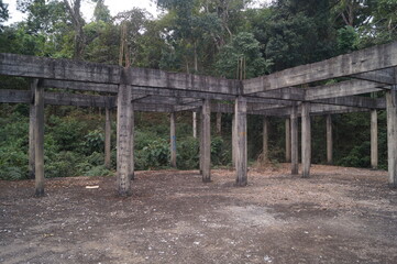 an abandoned place with a forest in the background
