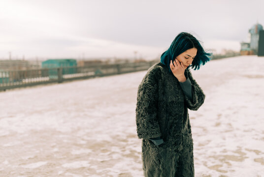 winter portrait of woman with blue hair