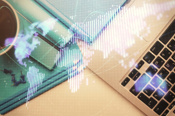 Business theme hologram drawings over computer on the desktop background. Top view. Multi exposure. Concept of international connections.