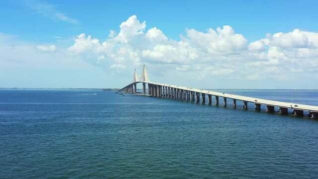Aerial lateral flyover Sunshine Skyway Bridge over Tampa Bay FL USA