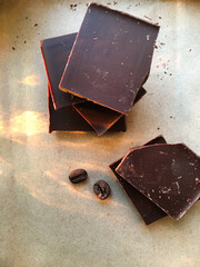 chocolate on wooden background. Flat lay top-down