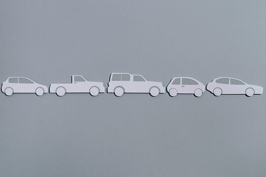 Paper car on grey background
