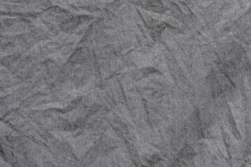 Fototapeta premium Crumpled gray fabric texture, background