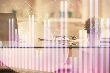 Double exposure of financial graph drawing and office interior background. Concept of stock market.