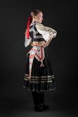 Beautiful woman wearing traditional Eastern Europe folk costumes. Slovak folk costumes.