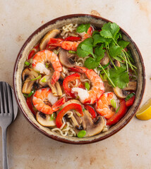 Prawn noodle soup with mushrooms and peppers