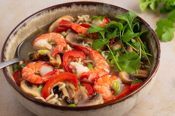Prawn noodle soup with mushrooms and peppers