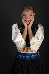 Beautiful woman wearing traditional Eastern Europe folk costumes. Slovak folk costumes.