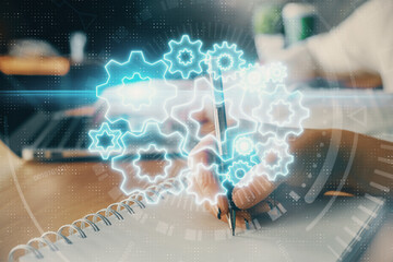 Double exposure of business theme drawing over people taking notes background. Concept of financial world