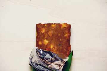 food or protein bar on a gray background. flat lay