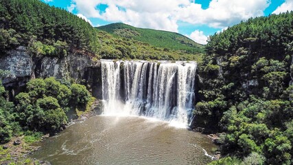 Aerial view of the Rio Cerquinha waterfall, in Bom Jesus, Rio Grande do Sul, Brazil. Beautiful waterfall among the green forest in Brazil