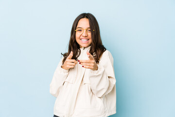 Young mixed race hispanic woman isolated cheerful smiles pointing to front.