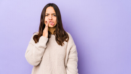 Young mixed race hispanic woman isolated having a strong teeth pain, molar ache.