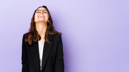 Young mixed race hispanic woman isolated relaxed and happy laughing, neck stretched showing teeth.