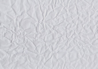 Closeup crumpled light grey paper  texture background, texture. Grey paper sheet board with space for text ,pattern or abstract design backdrop.