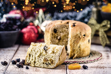 homemade fruit panettone, a typical Brazilian or Italian Christmas bread, with bokeh light in the background
